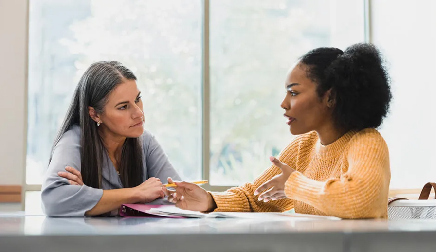 Two women talking.