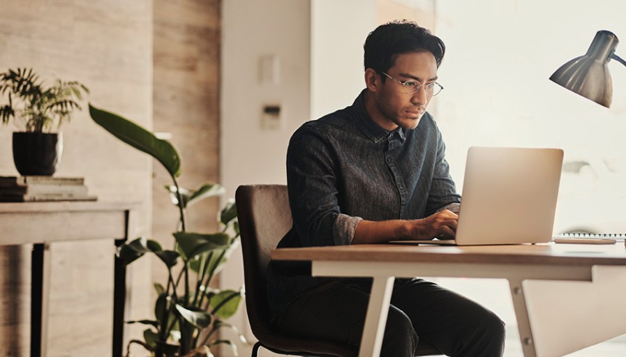 Man typing on computer