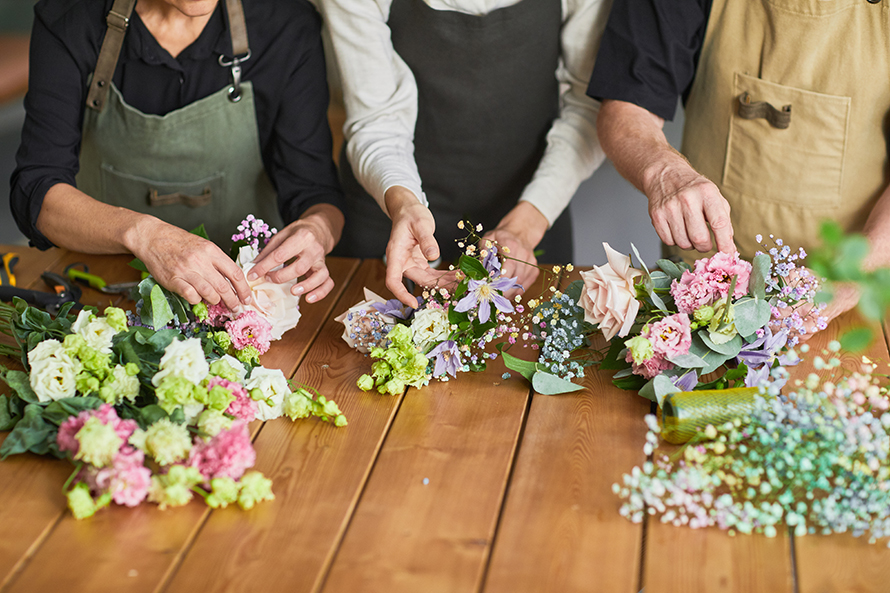 People arranging flowers. 