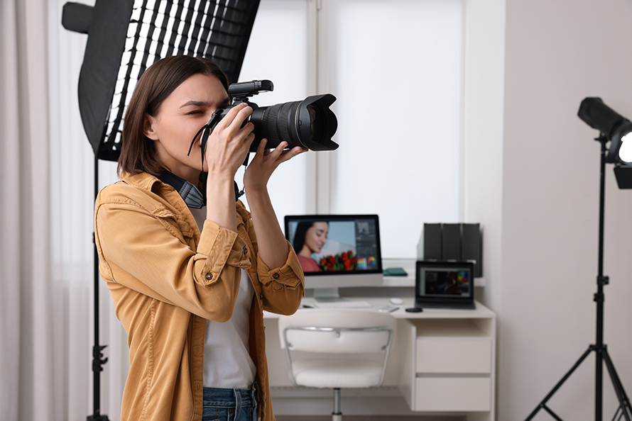 Photographer holding camera. 