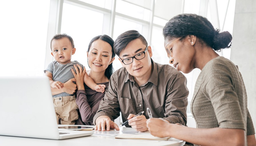 A family looking over documents.